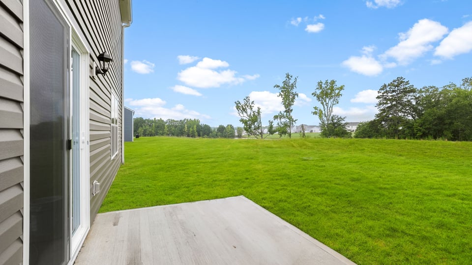 Back exterior with large backyard.