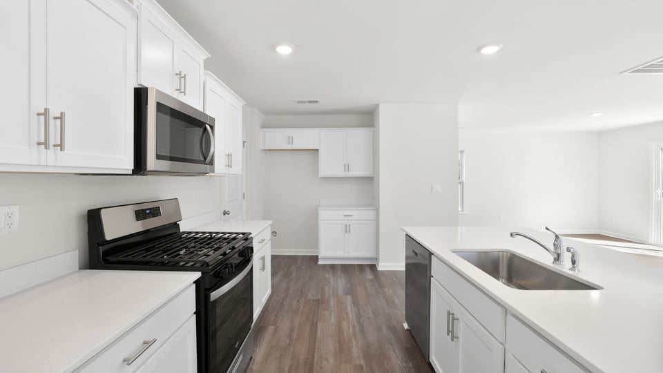 Kitchen with stainless steel appliances.