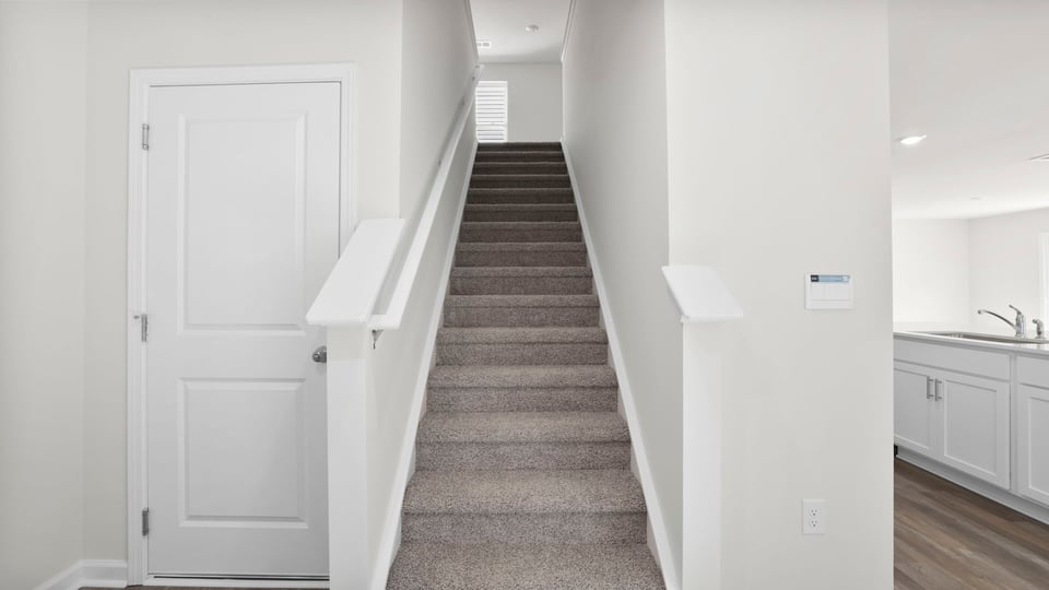 View of stairs to bedroom.