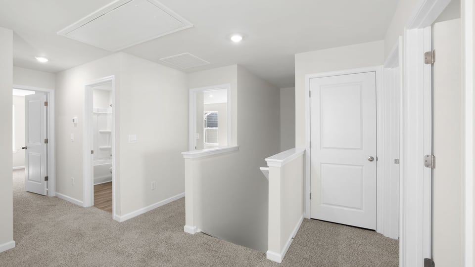 Loft area with carpet.