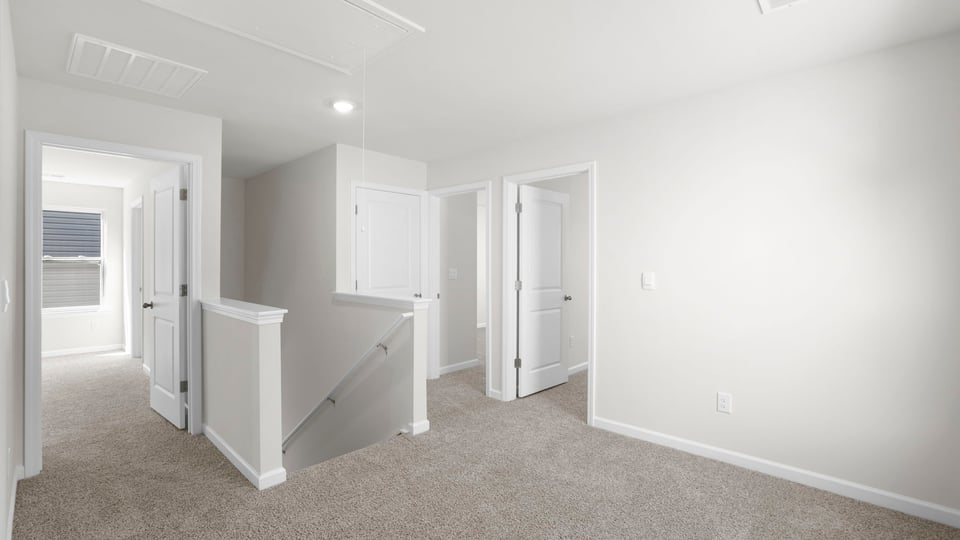 Loft area with carpet.