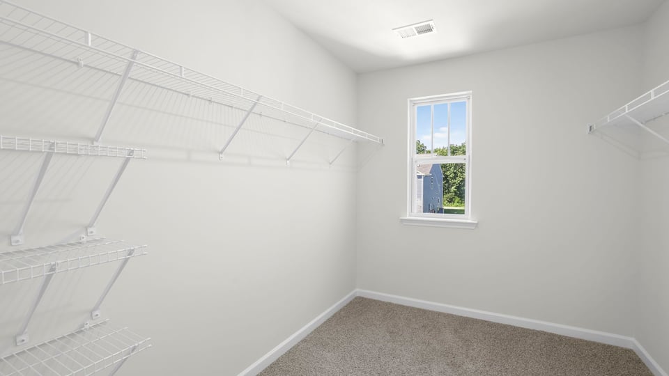 Closet with hanging storage racks.