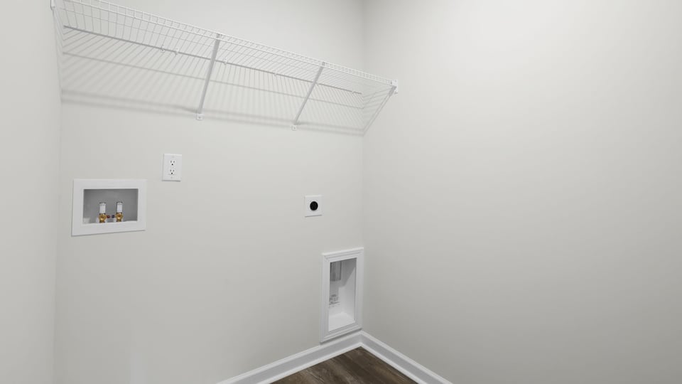 Laundry room with hanging storage racks.