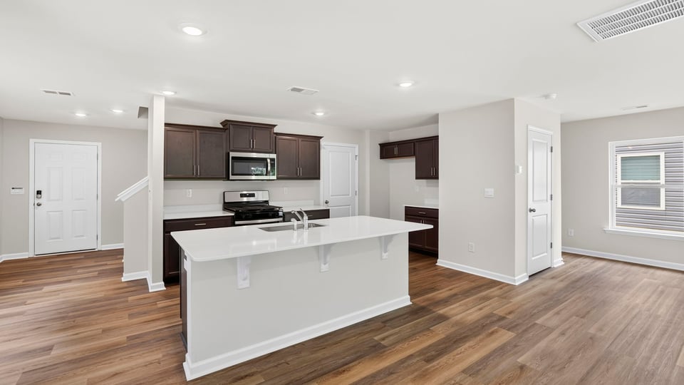 Kitchen with island and cabinets.