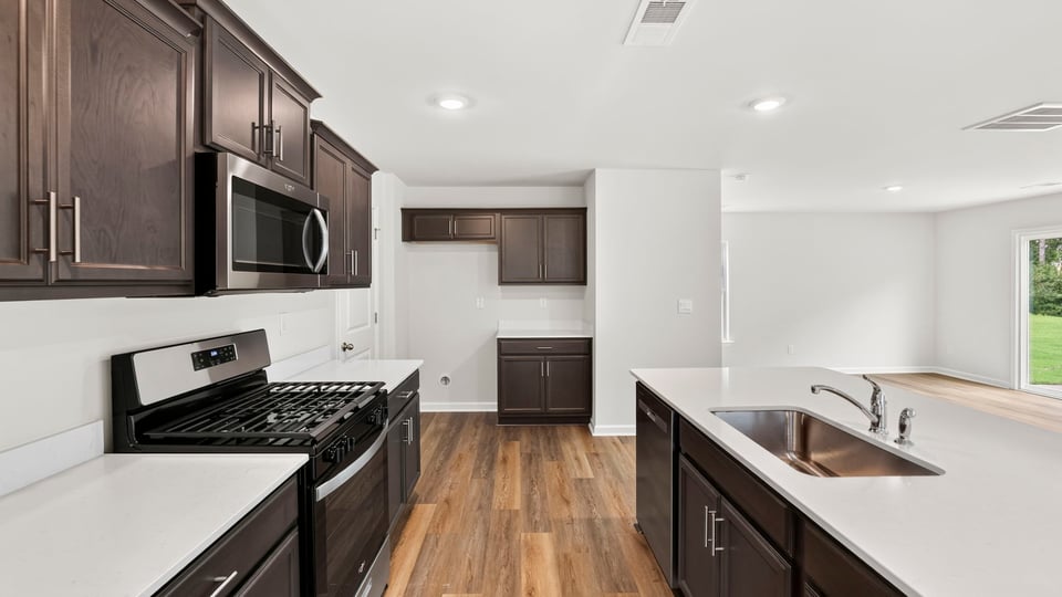 Kitchen with island and cabinets.