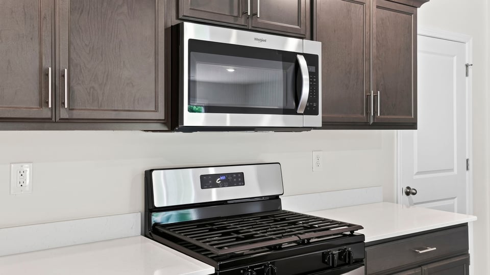 Kitchen with island and cabinets.