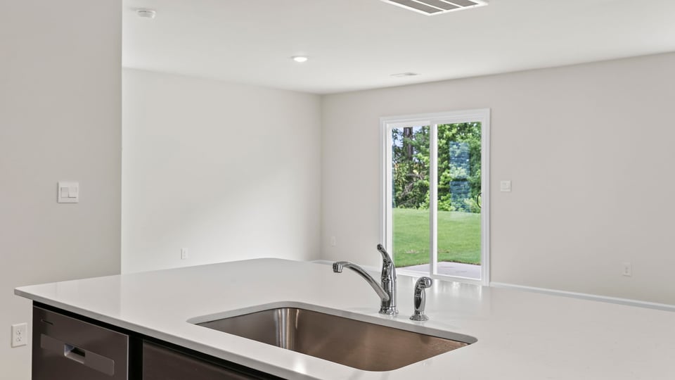 Kitchen with island and cabinets.