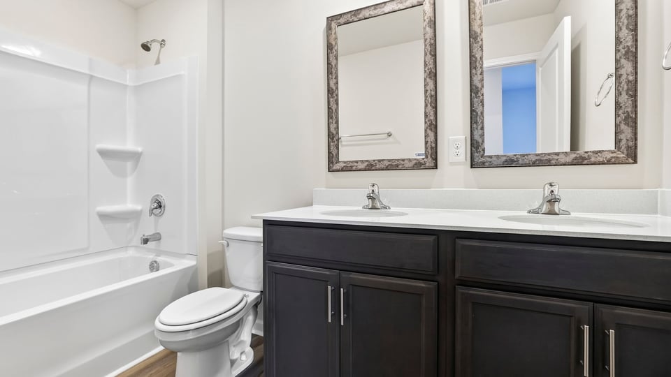 Bathroom with double vanity sinks.