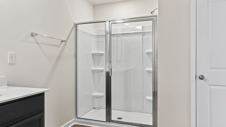 Primary bathroom with double vanity sinks.a