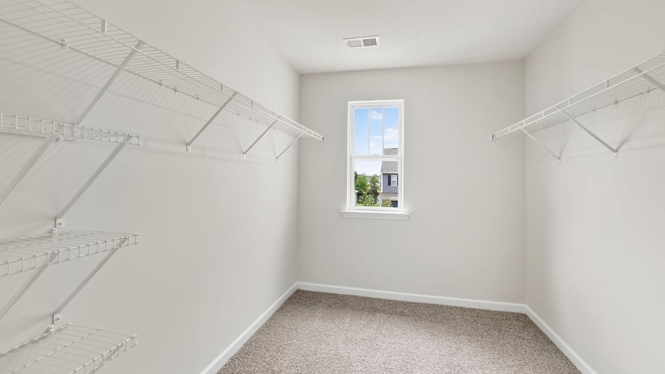 Primary closet with window.