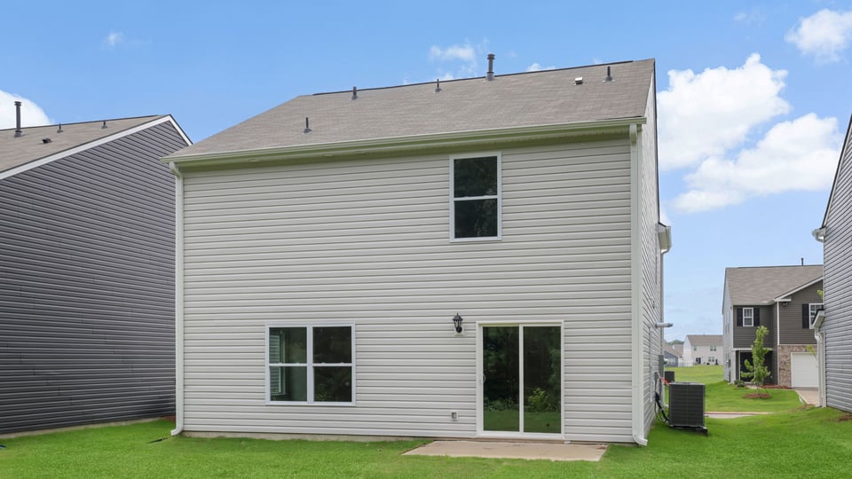Back exterior with large backyard.