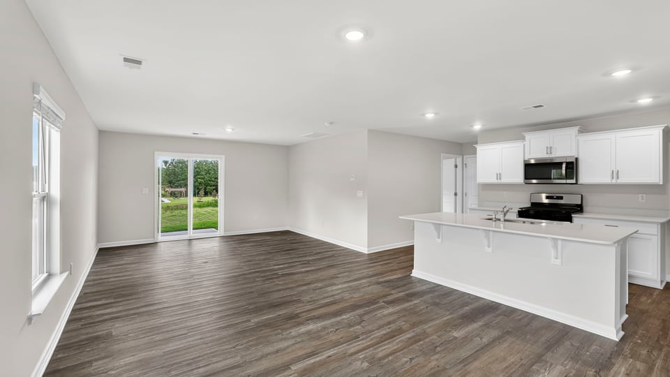 Kitchen with island and cabinets.