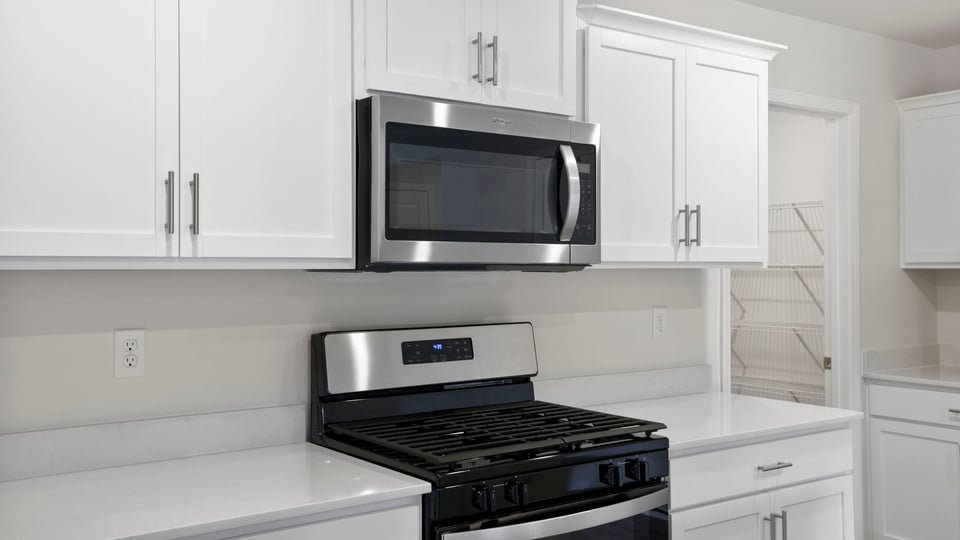 Kitchen with island and cabinets.