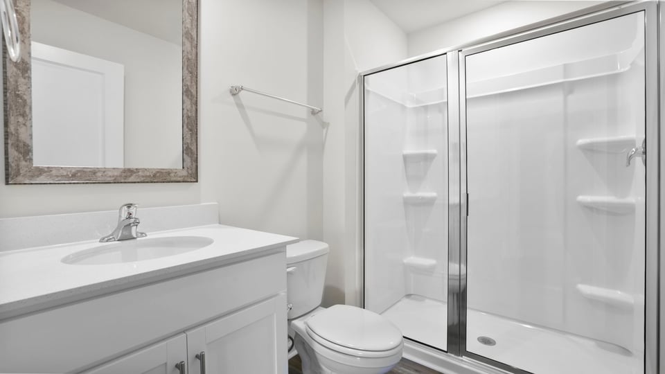 Bathroom with vanity sinks.