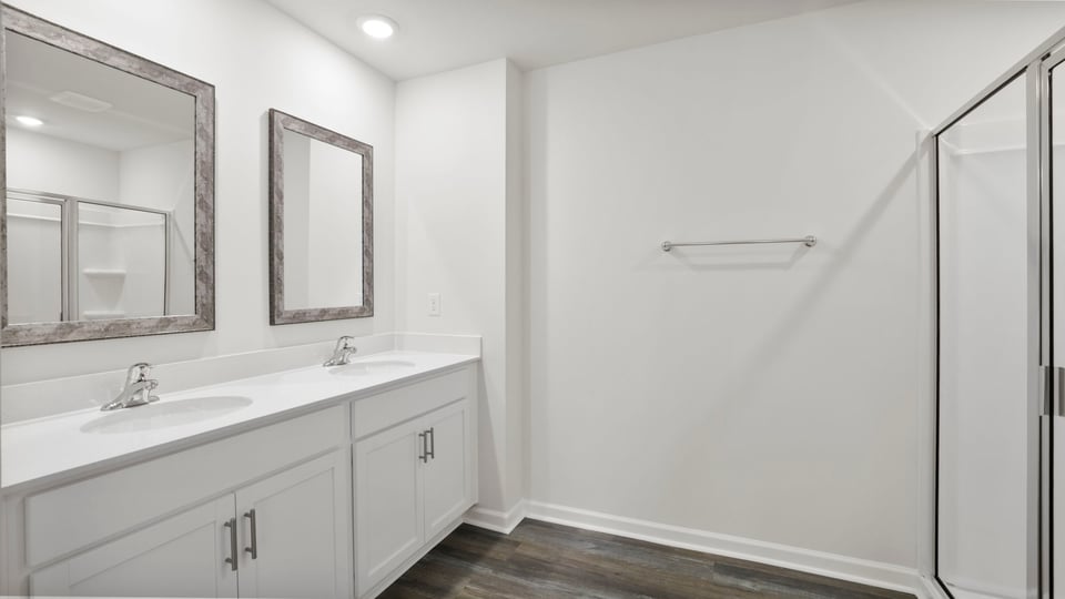Primary bathroom with double vanity sinks.