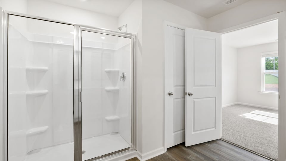 Primary bathroom with double vanity sinks.