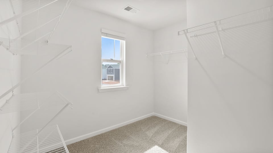 Primary closet with window.