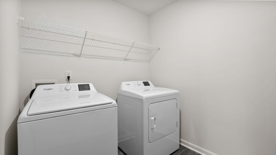 Laundry room with shelf.