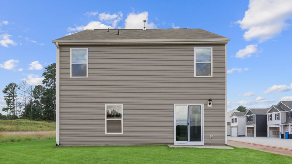 Back exterior with large backyard.