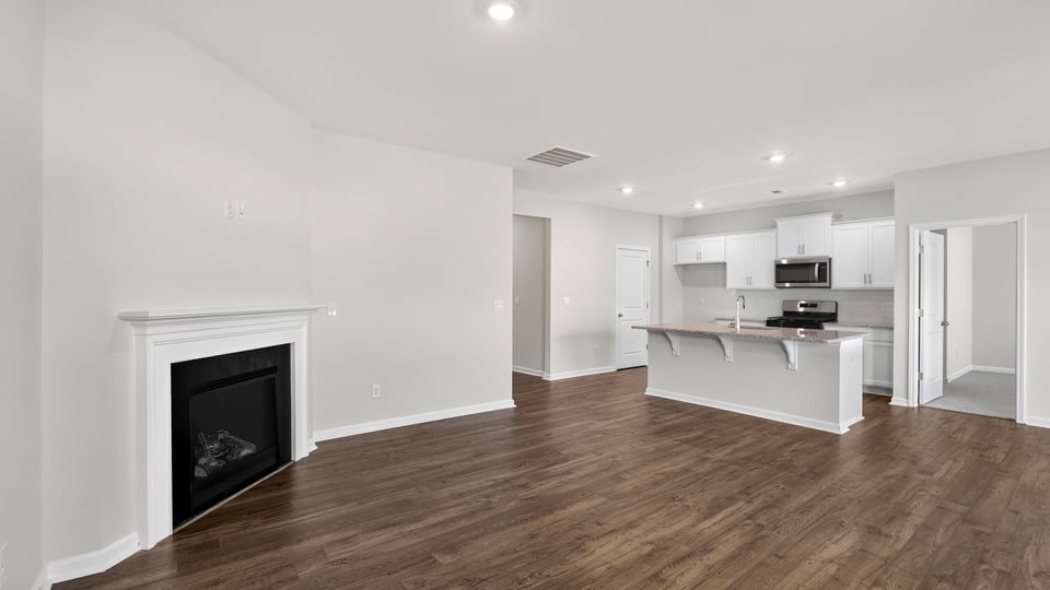 Family room with windows and fireplace.