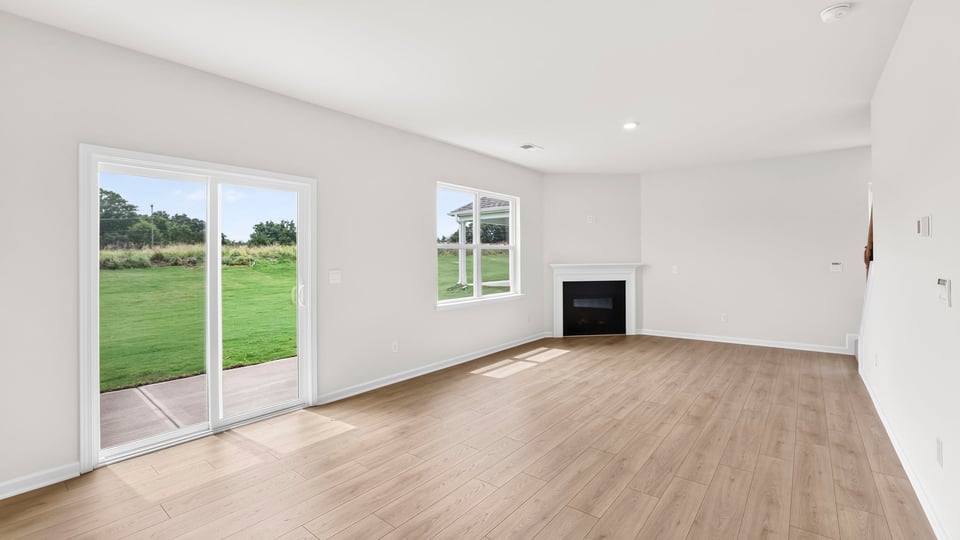 Living area with window and fireplace.