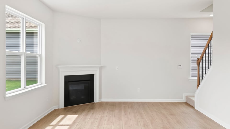 Living area with window and fireplace.