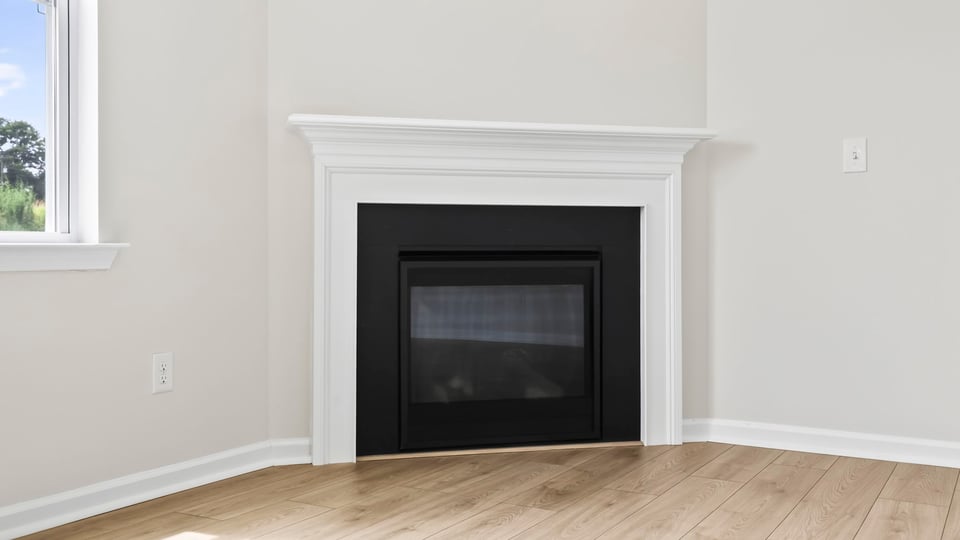 Living area with window and fireplace.