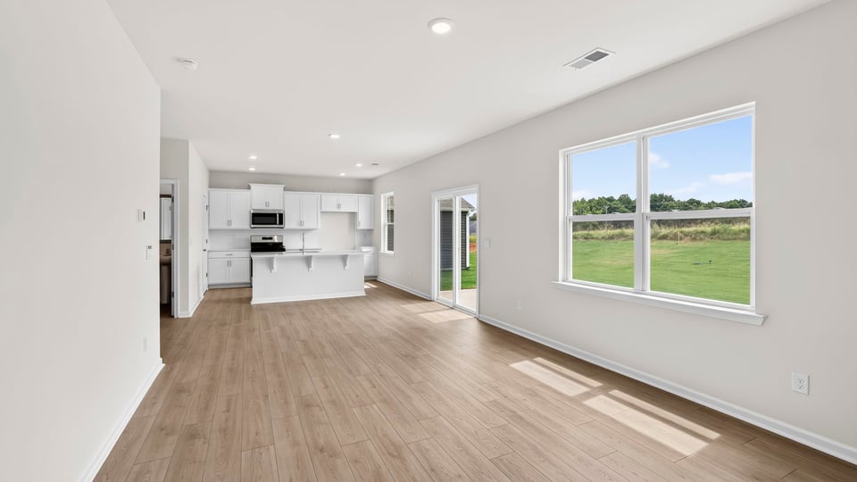 Living area with window and fireplace.