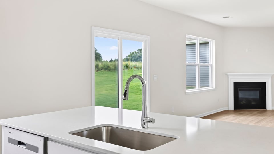 Kitchen with island and cabinets.