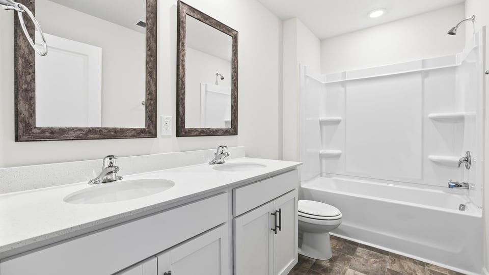Bathroom with double vanity sinks.