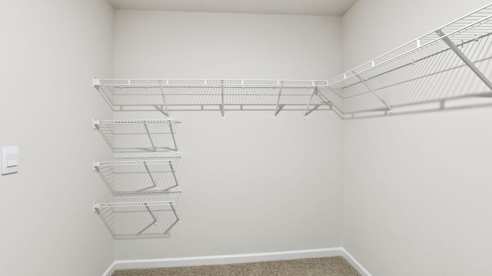 Primary closet with shelf.