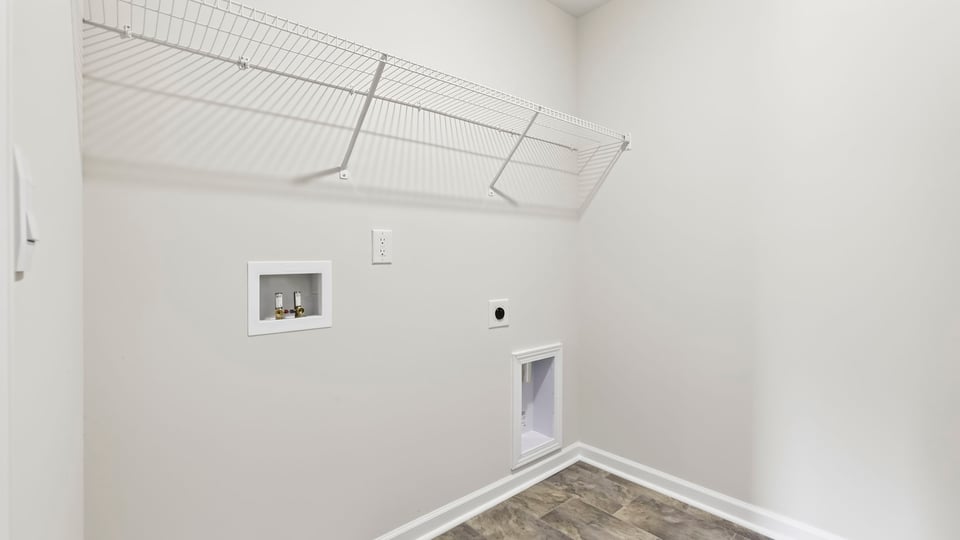 Laundry room with shelf.