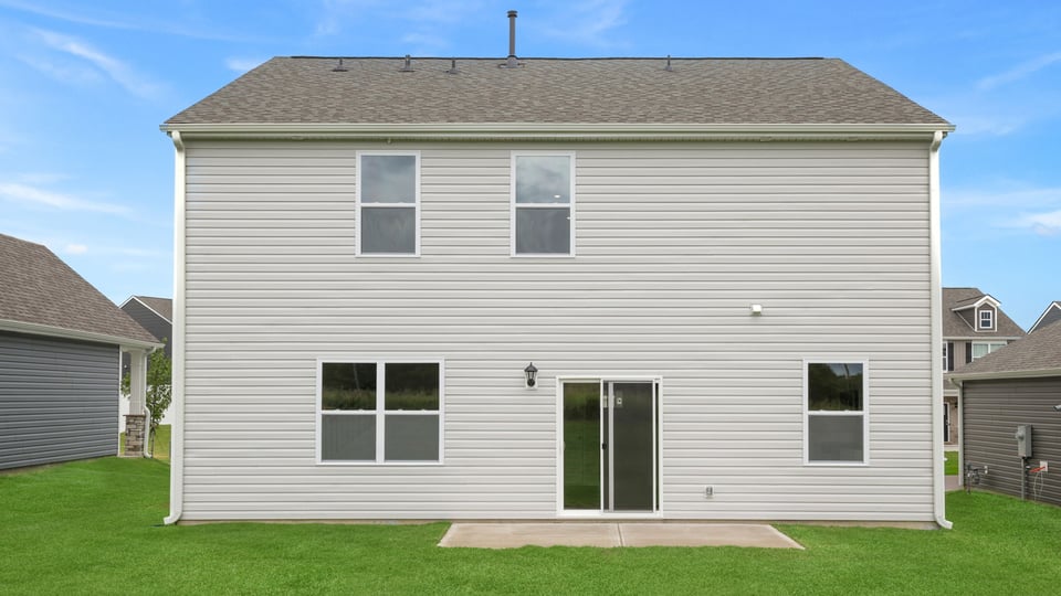Back exterior with large backyard.