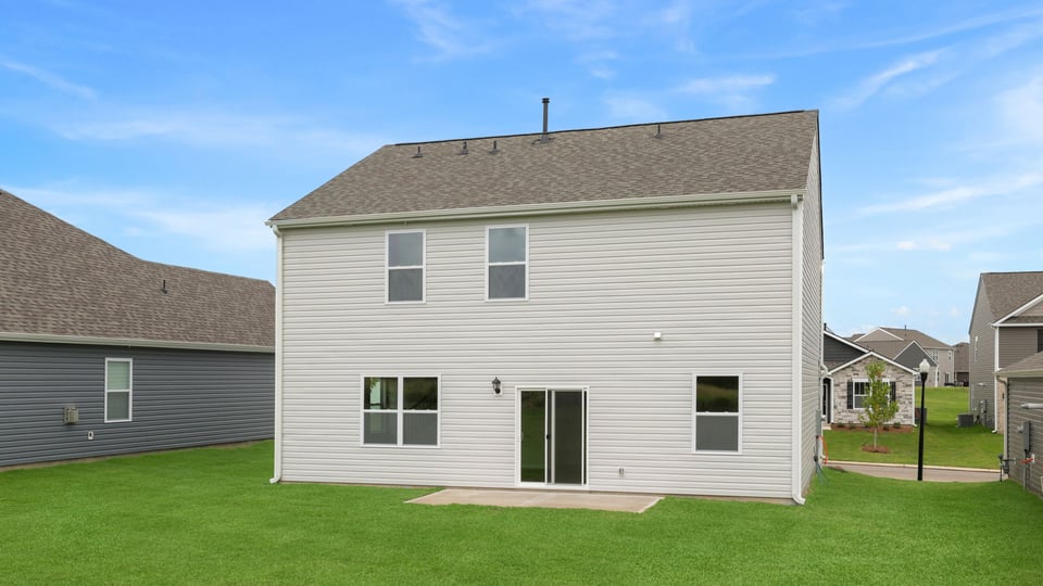 Back exterior with large backyard.