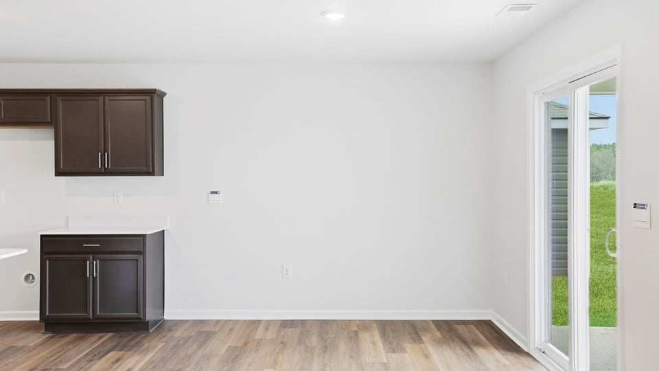 Kitchen and island with stainless steel appliances.
