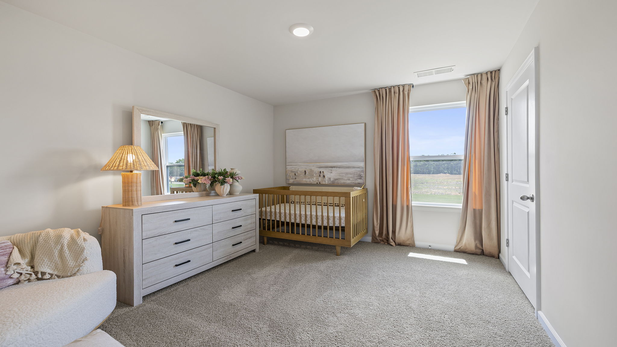 Bedroom with carpet and window.
