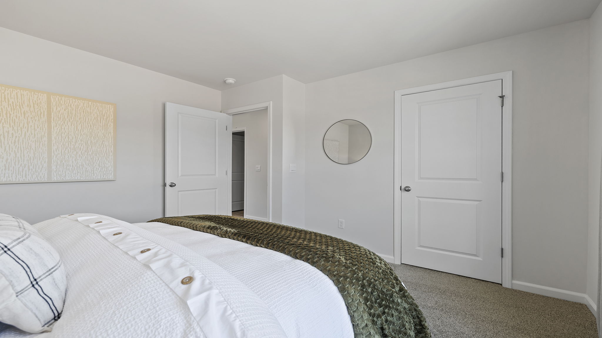 Bedroom with carpet and window.