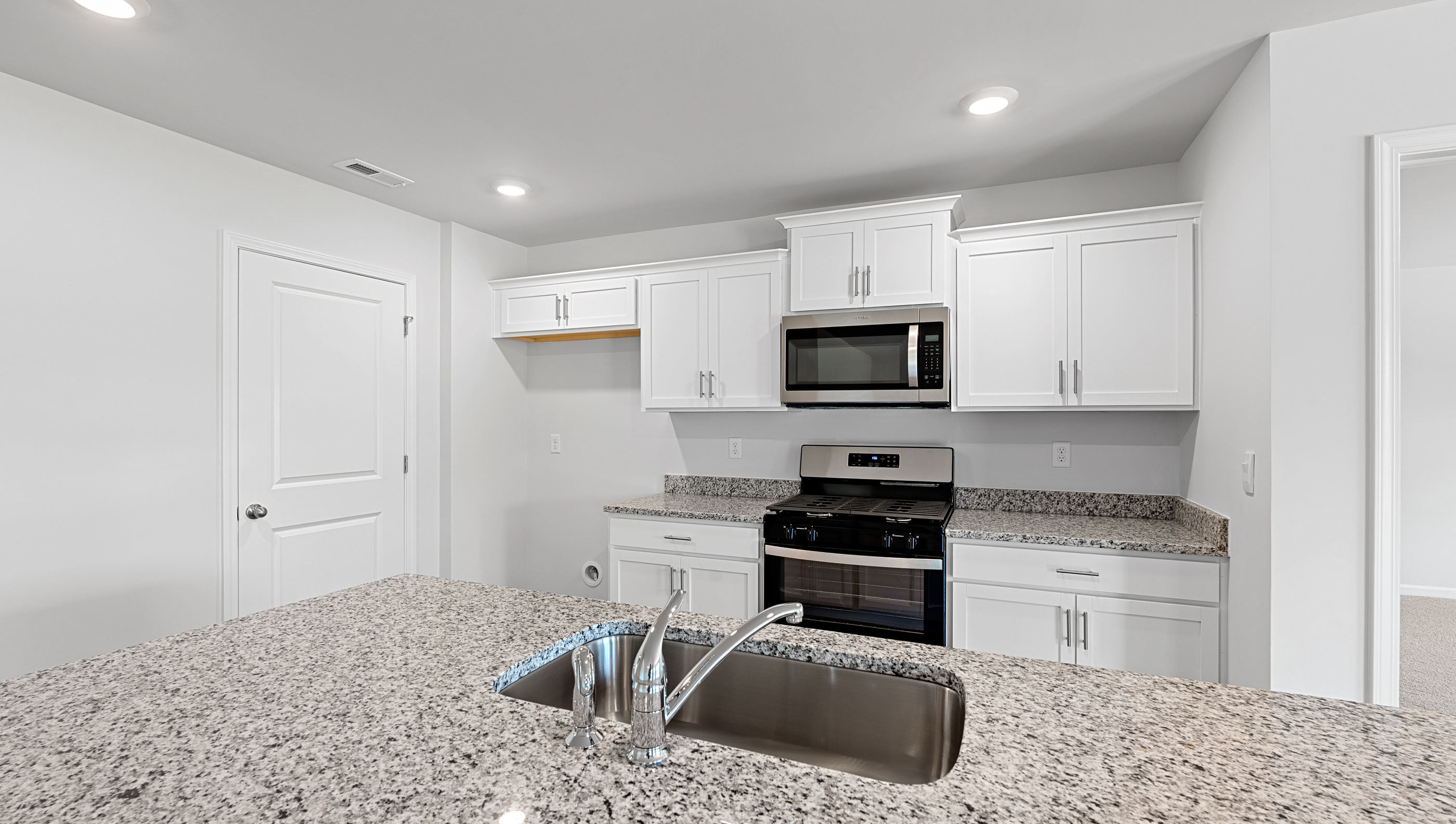 Kitchen with island countertops.