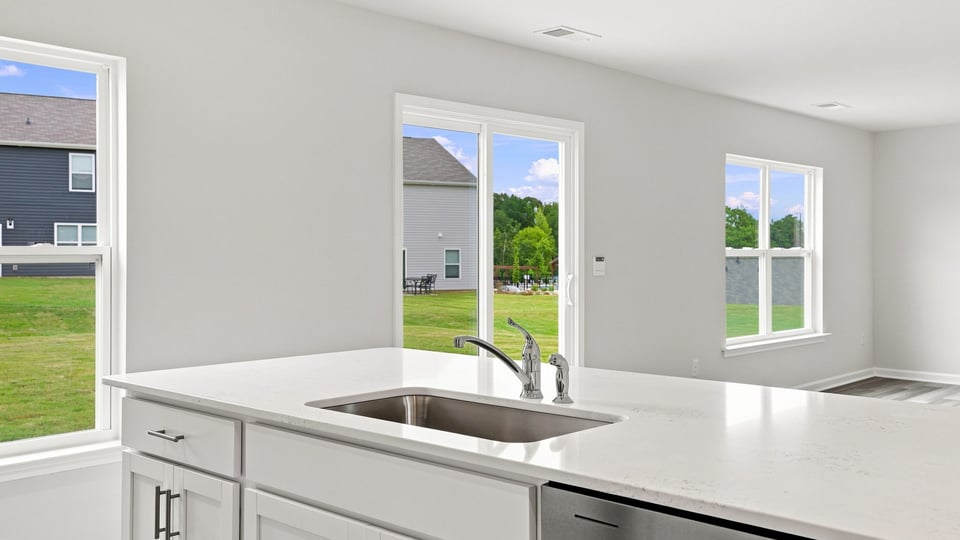 Kitchen with island and cabinets.