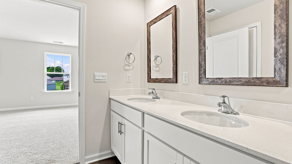 Primary bathroom with double vanity sink.