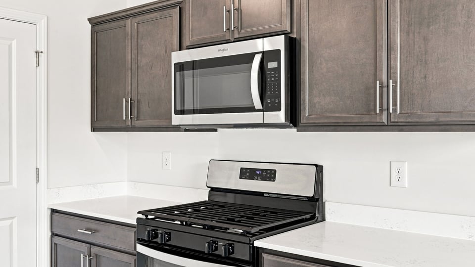 Kitchen with island and cabinets.