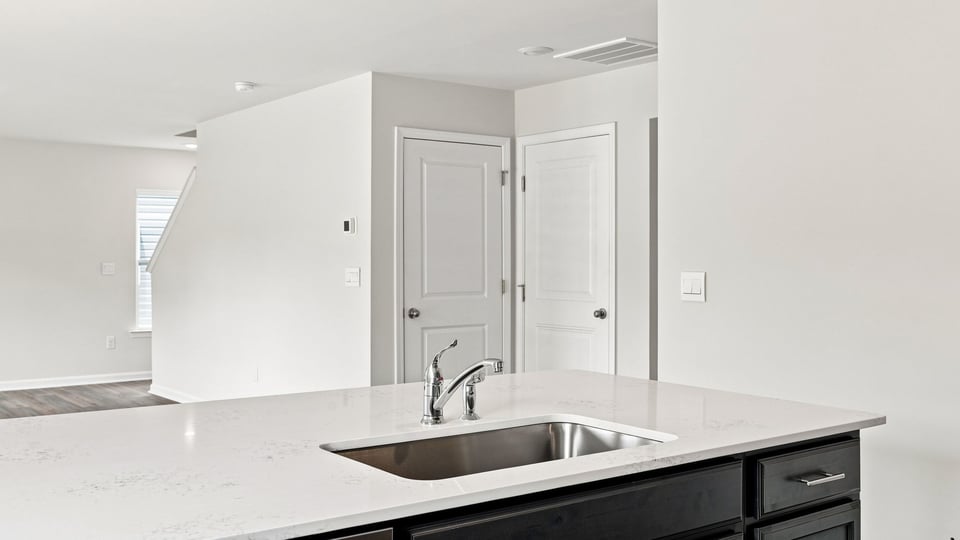 Kitchen with island and cabinets.