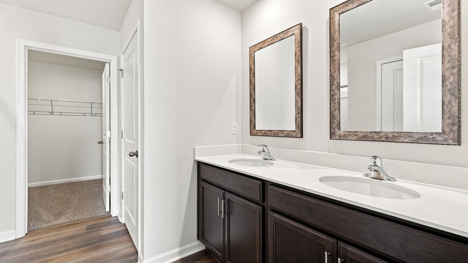 Primary bathroom with double vanity sinks.