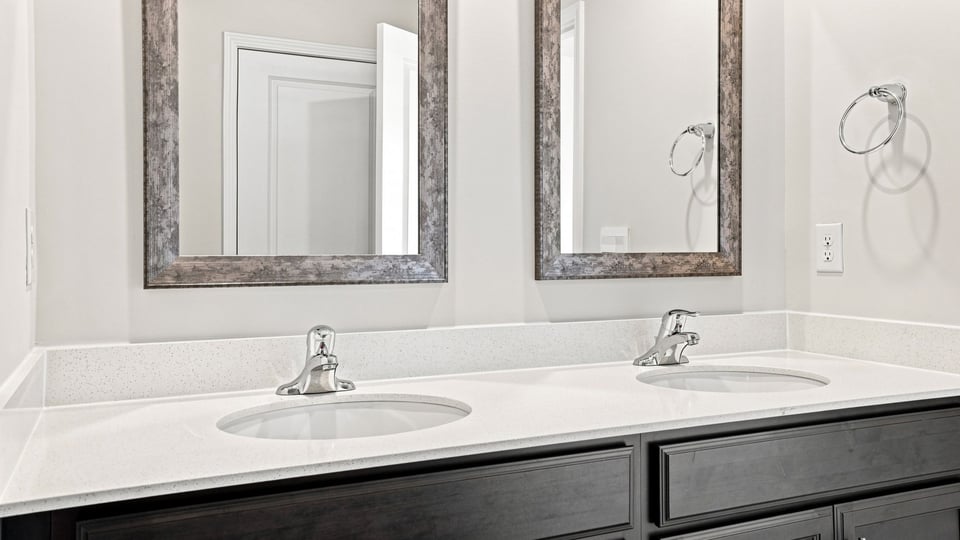 Primary bathroom with double vanity sinks.