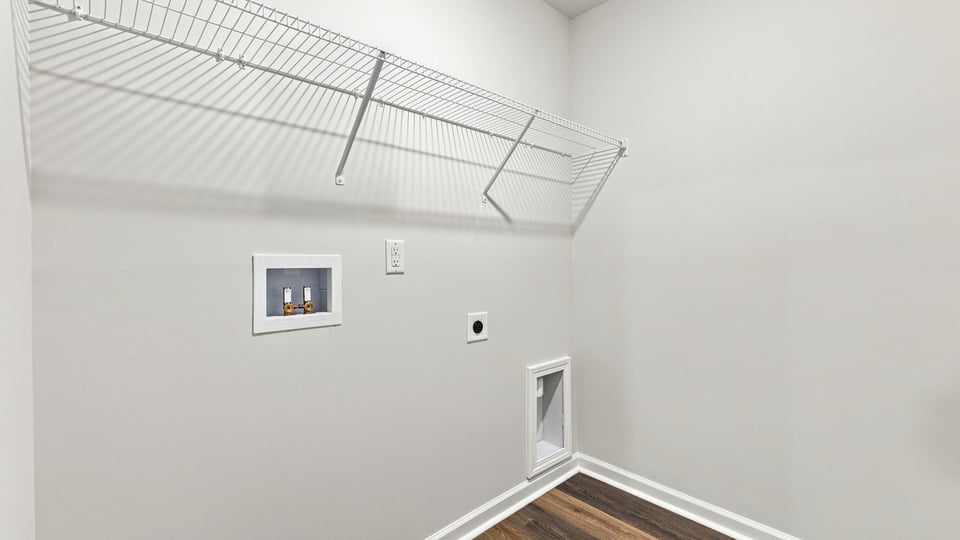 Laundry room with shelf.