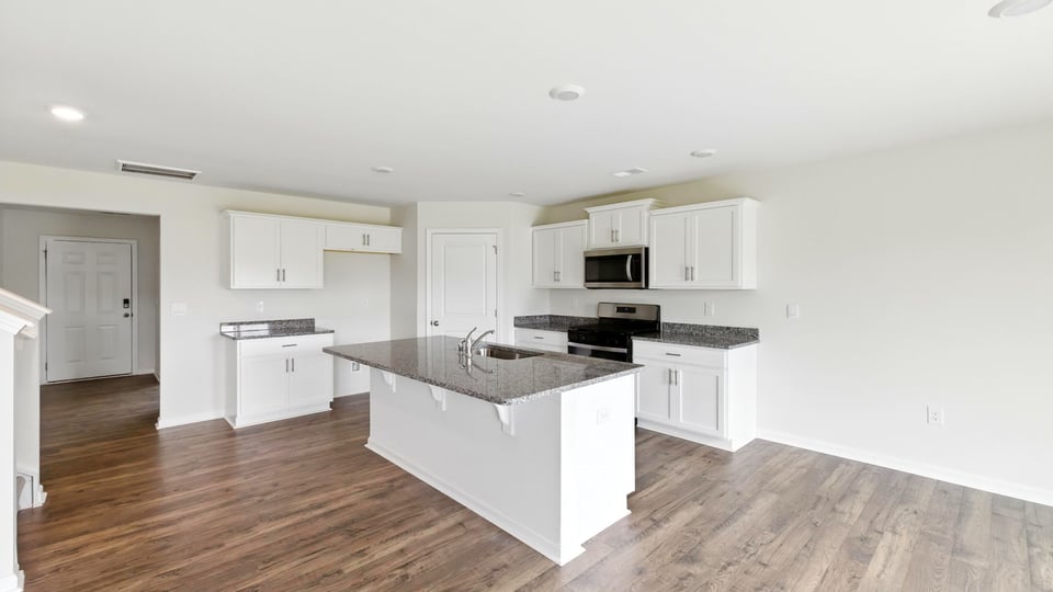 Kitchen with island and cabinets.