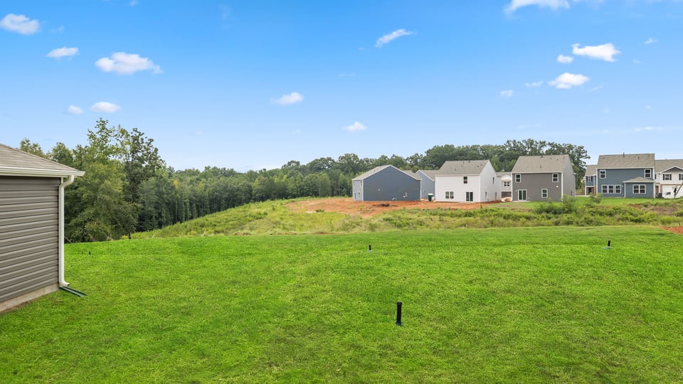 Back exterior with large backyard.