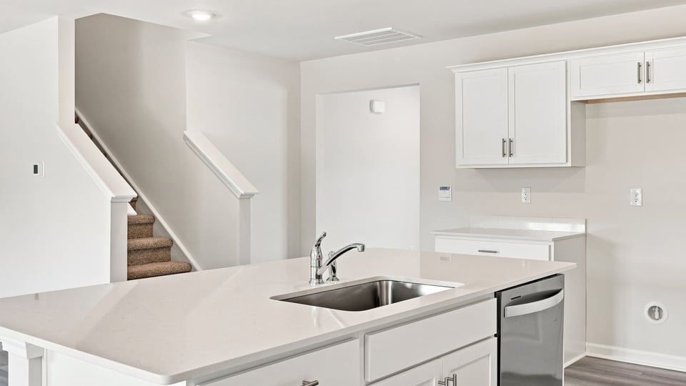 Kitchen with island and cabinets.