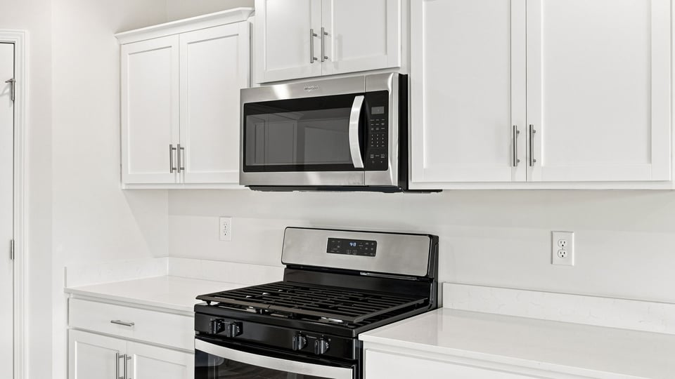 Kitchen with island and cabinets.