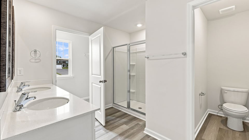 Primary bathroom with vanity sinks.